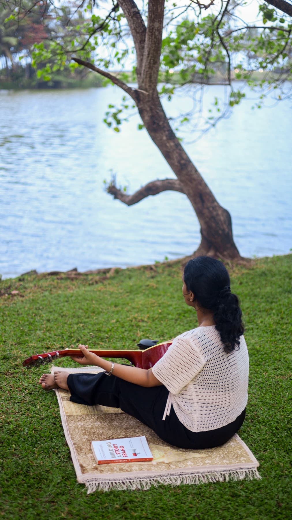 Yoga and meditation by the river under a tree